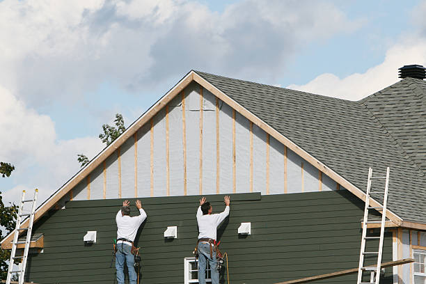 Professional Storm Damage Siding Repair technician working in Alger, OH
